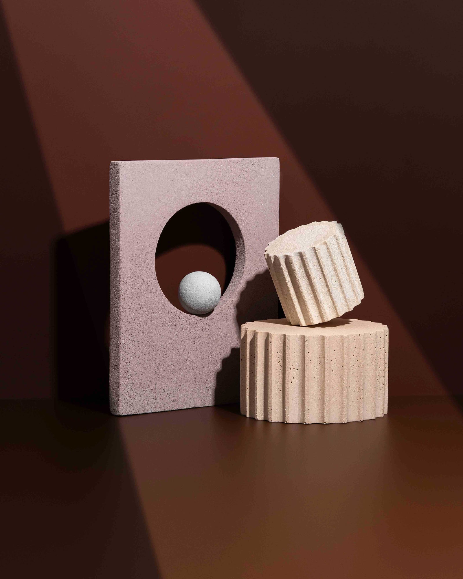 Sculptural mineral photography props arranged with directional light to demonstrate an art director’s control of geometry, texture and shadow