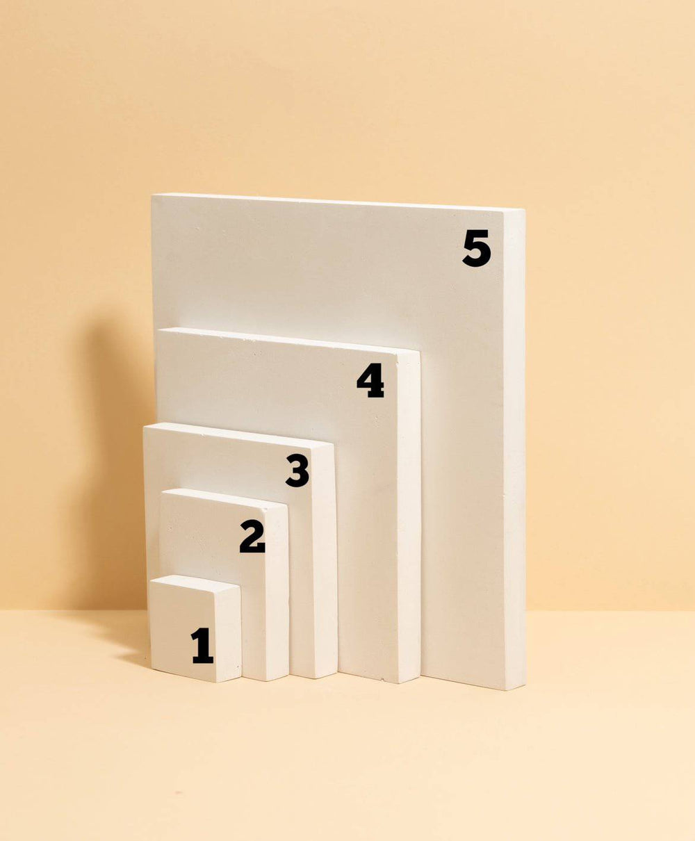 Modular white jewelry display blocks in different sizes for showroom styling and visual merchandising