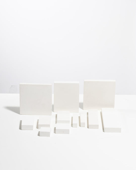 White modular display set with upright blocks and flat bars arranged together