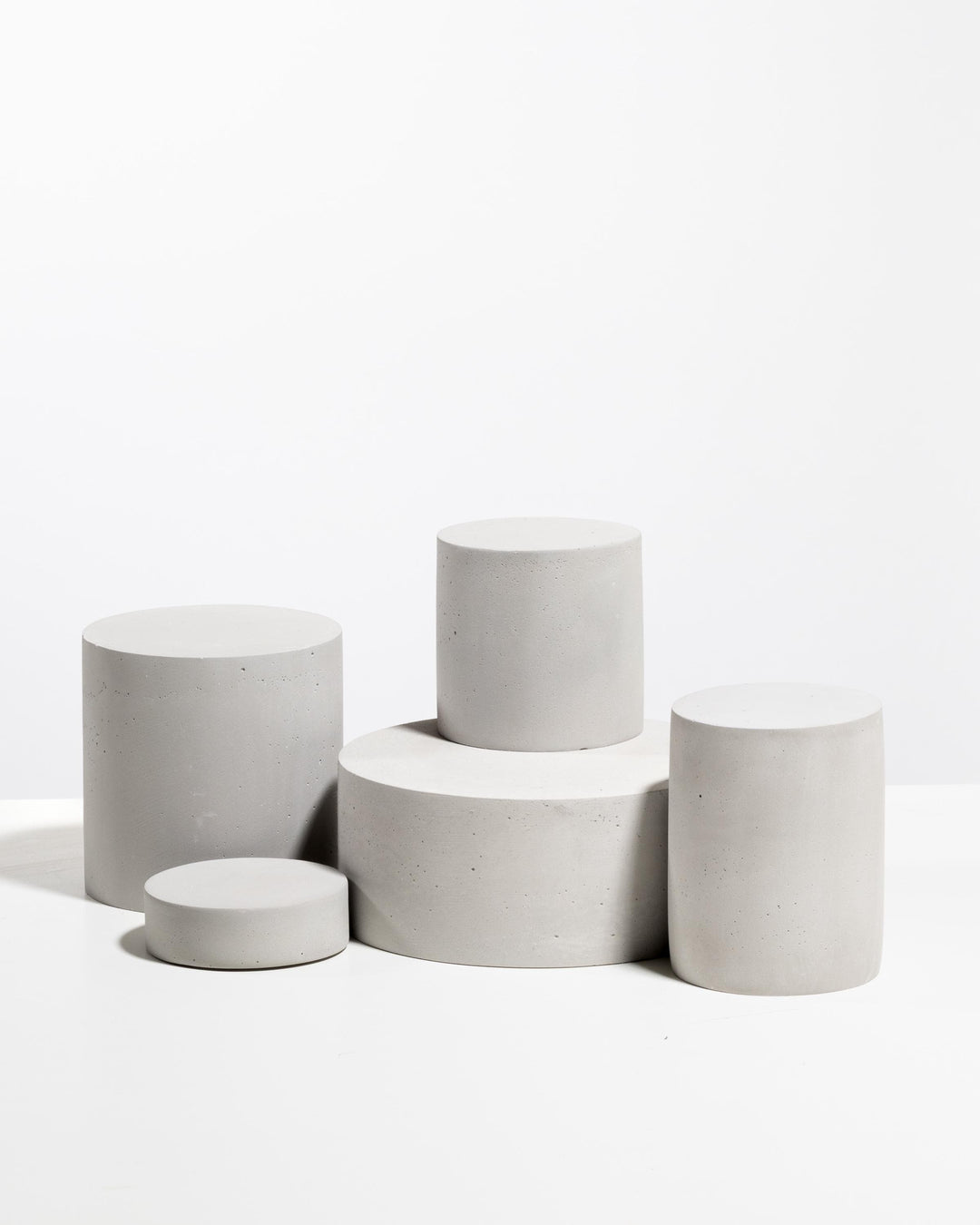 Minimal architectural display risers for cosmetic brands and luxury retail counters