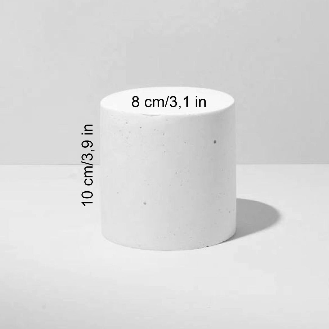 Tall plaster cylinder riser for boutique counters and skincare presentation