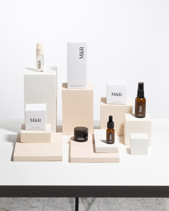 Skincare products styled on modular concrete display pedestals