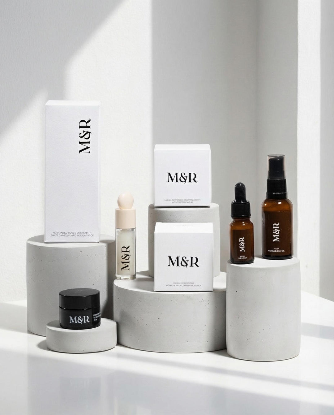 Minimal plaster cylinder risers styled with luxury skincare packaging for boutique retail presentation