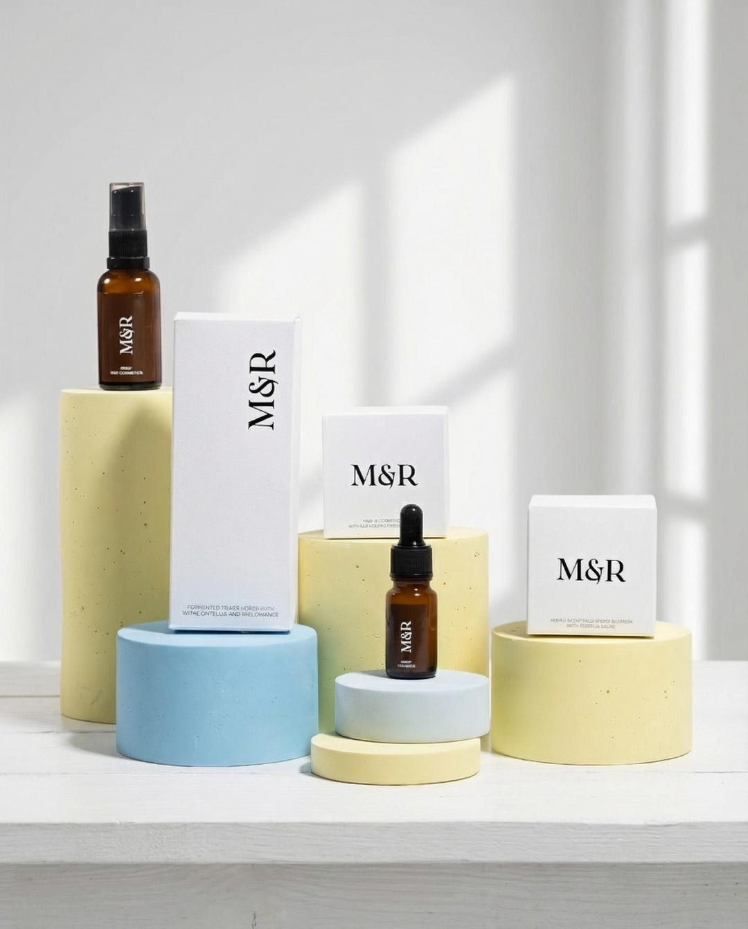 Minimal cosmetic boutique display with pastel podium blocks styled with skincare bottles and jars