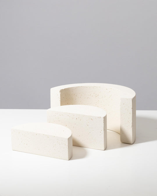 Off white textured plaster risers arranged for product photography