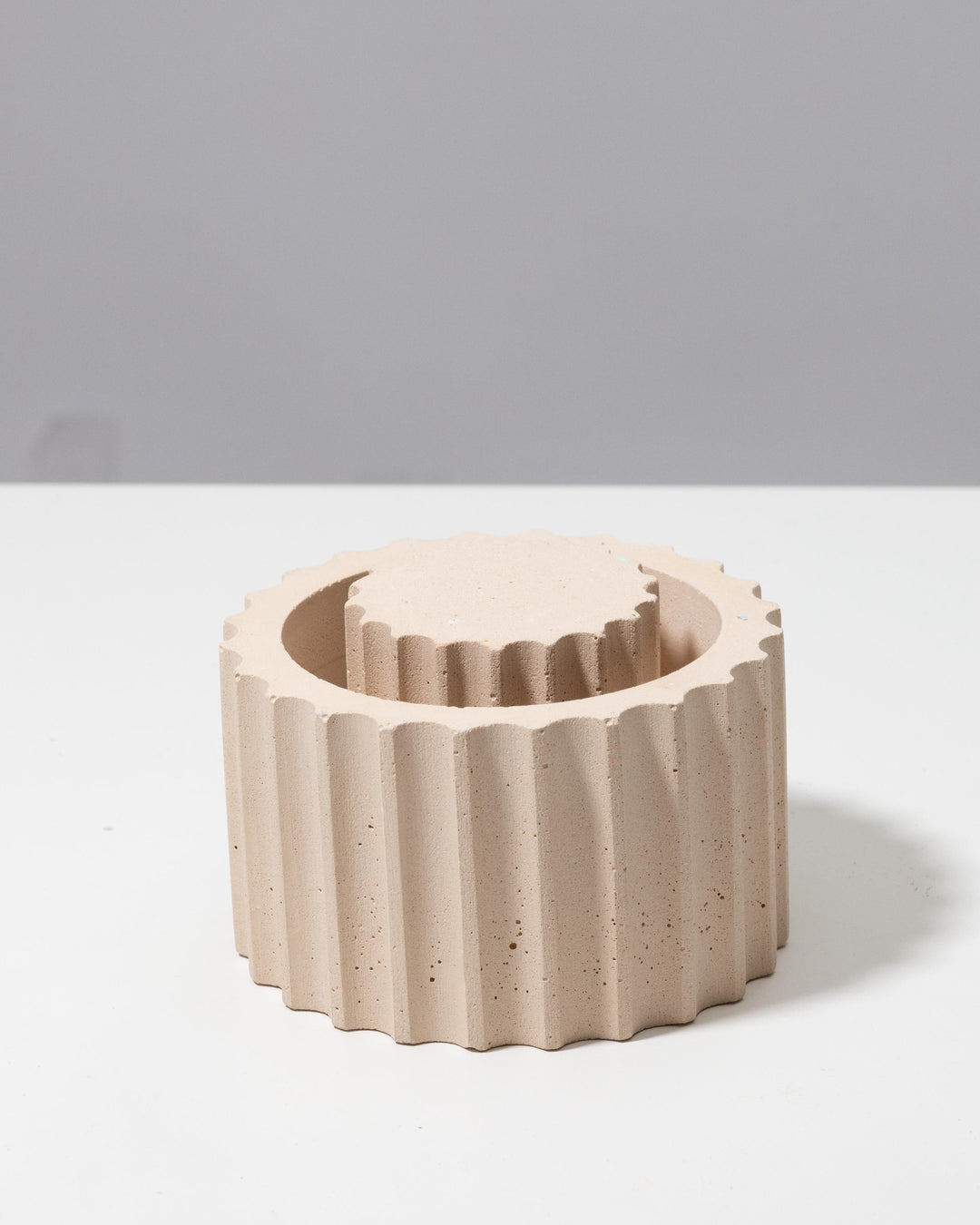 Fluted pedestal with removable scalloped lid, usable as a small container