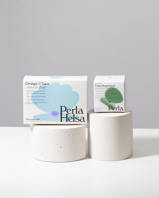 Textured white riser set styled with supplement packaging for product photography