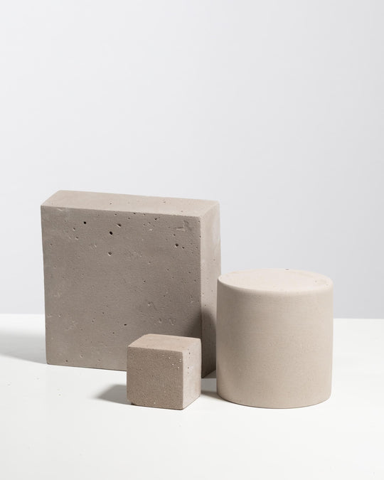 Light grey plaster styling set with flat slab cube and cylinder for product display