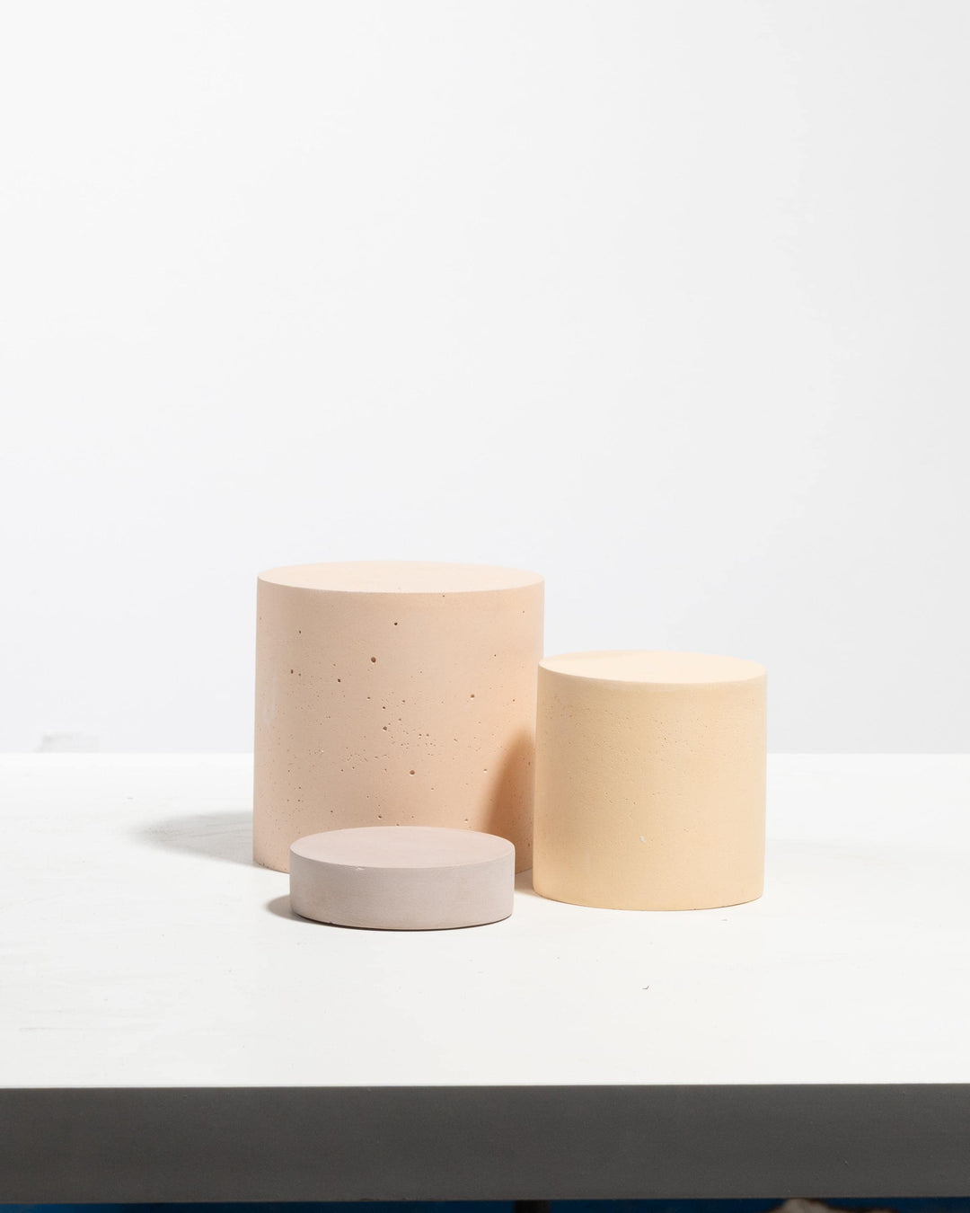 Exhibition product plinth set styled for brand presentation